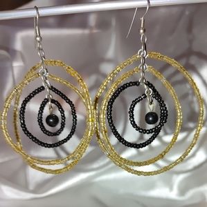 Black and gold rotating hoop earrings